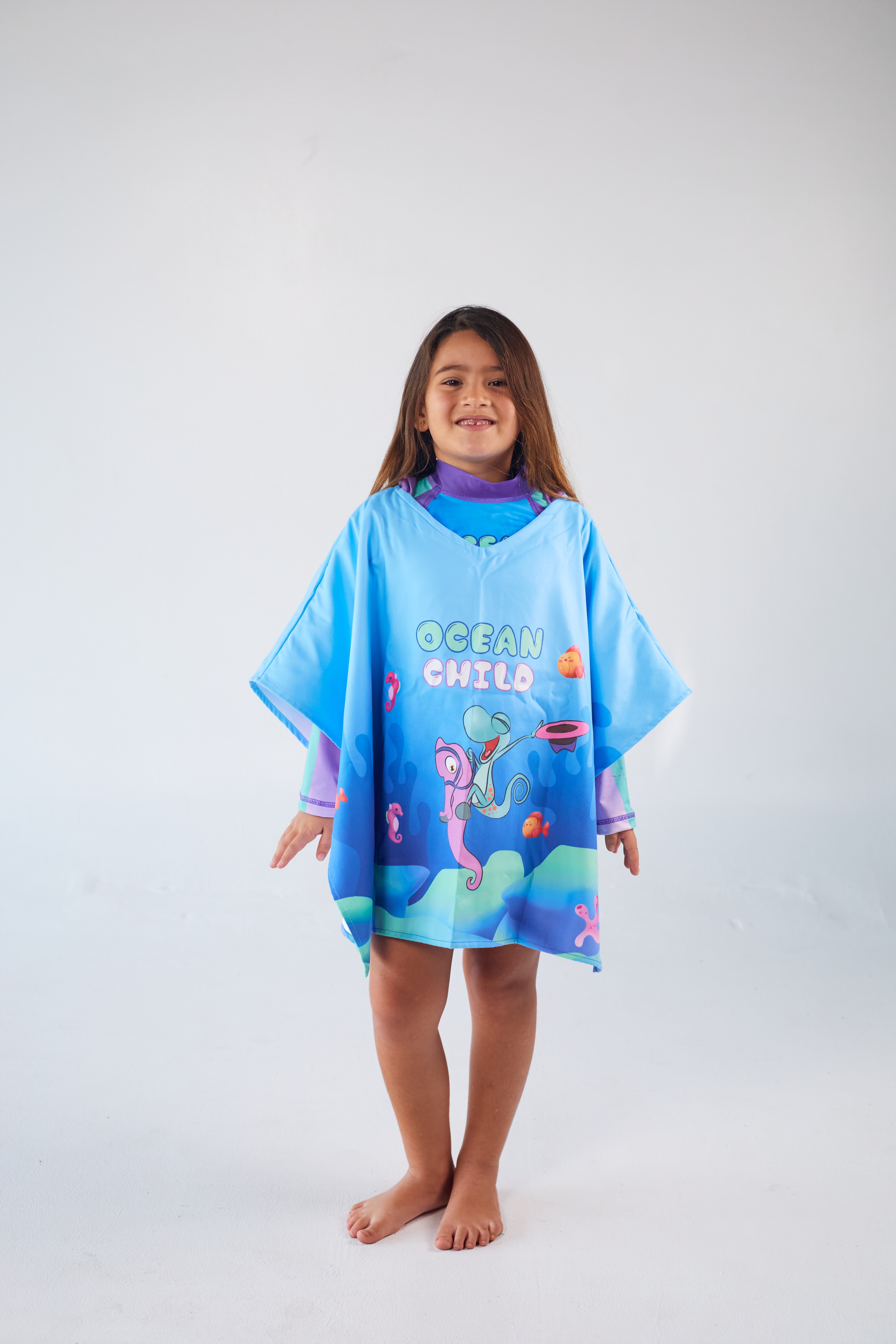 Toalla Poncho Cuadrada Niña Caballito de Mar – Morado/Turquesa